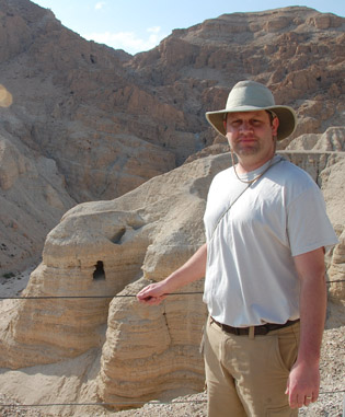 Ryan Habbena in front of Cave 4 at Qumran.